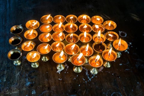 Many butter lamps are lightened at a temple in Boudha