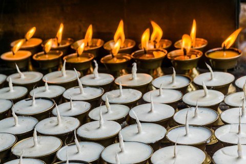 Many butter lamps are lightened at a temple in Boudha