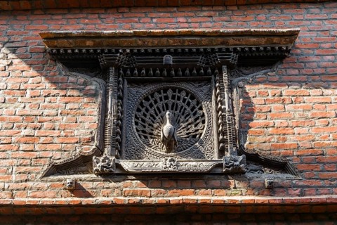 Carved wooden Peacock Window at a house