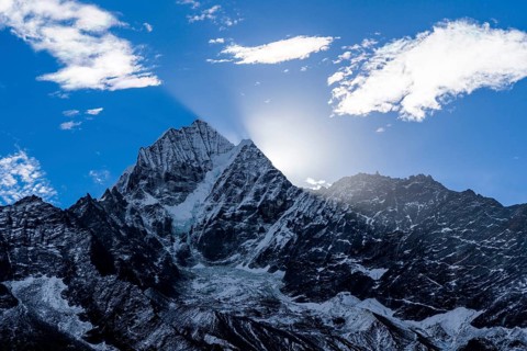 Sun rising up over Kangtega mountain