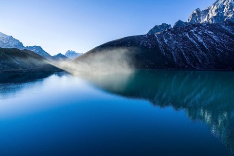Morning mist over Gokyo Lake at sunrise