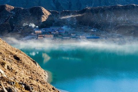 Morning mist over the lake and village of Gokyo at sunrise