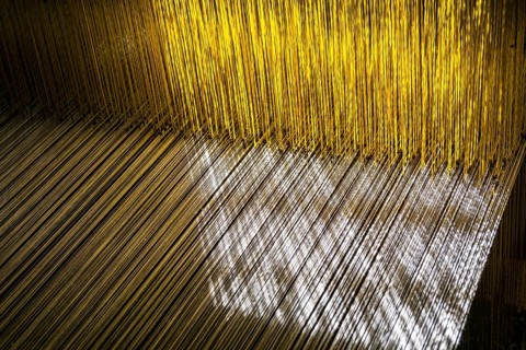 Detail of the old traditional looms for weaving the material for the traditional nepali Dhaka topi hats