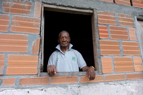 Old man looking out of window