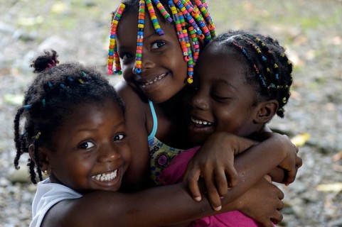 Three girls hugging each other