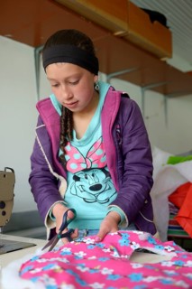 Girl cuts fabric