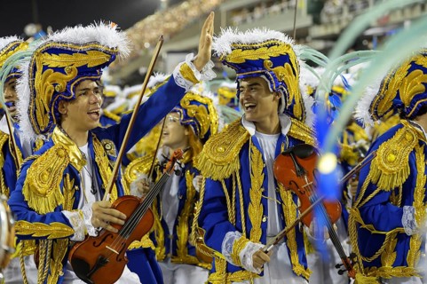 Teenagers in costumes with violins