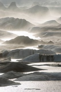 Glacial lake and glacier in fog