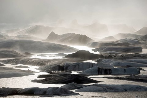 Glacial lake and glacier in fog