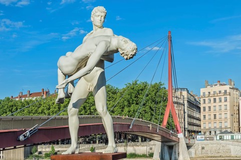 The Weight of Oneself statue on the banks of the Saone River near the Palais de Justice footbridge, Lyon