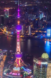View over Pudong with Oriental Pearl Tower at night