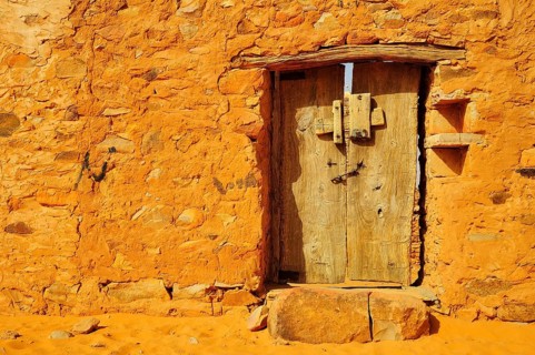 Old wooden door of an Islamic library in the historic centre