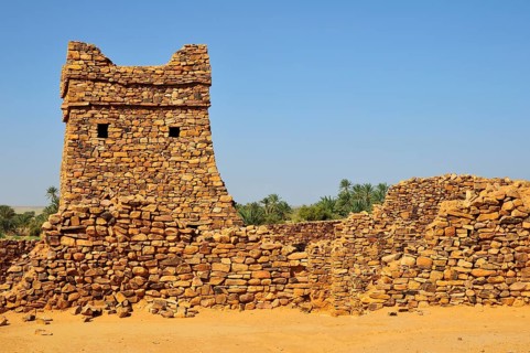 Ruins and minaret of the fortified trading post or Ksar