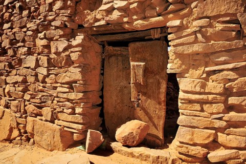 Old wooden door in the fortified trading post or Ksar