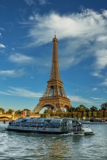 Eiffel Tower with passenger ferry Bateaux Mouches on the Seine