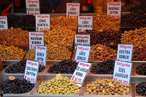 Several varieties of olives at a market stall