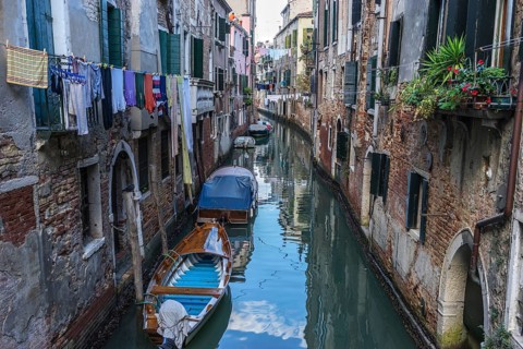Canal with boats moored