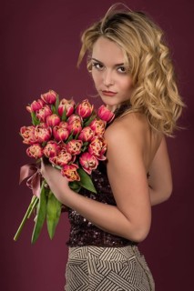 Young woman with a bouquet of tulips