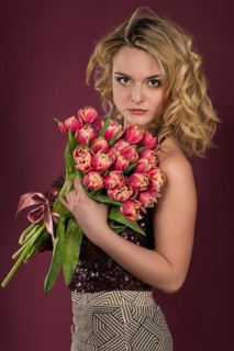 Young woman with a bouquet of tulips