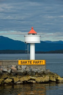 Molde lighthouse with sail slowly warning sign