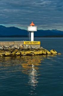Molde lighthouse with sail slowly warning sign