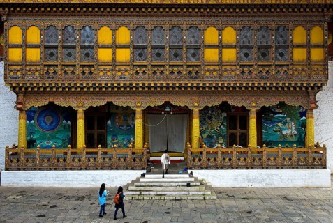 Tourists at the entrance to the coronation temple in the monastery fortress Punakha Dzong