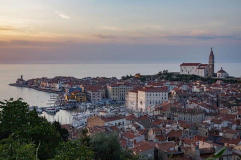Cityscape with lighthouse and Cathedral of St. George