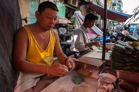 Man preparing betel nut for sale