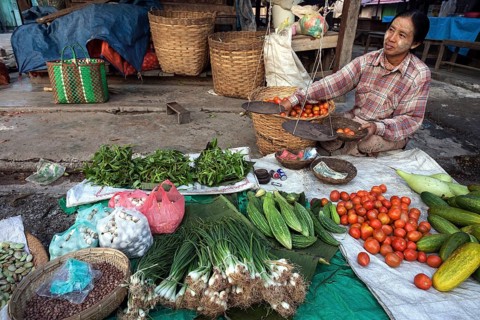 Local woman selling vegetables at the market in Nyaungshwe