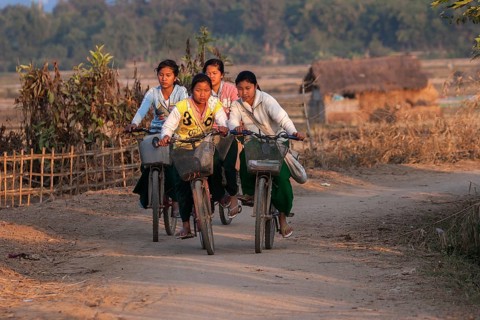 Local girls on bicycles returning from school