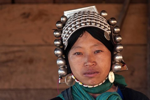 Local woman from the Akha tribe with typical headgear