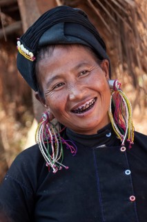Native woman in typical clothing and headgear from the Ann tribe in a mountain village at Pin Tauk