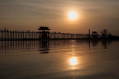 People walking on the U Bein Bridge