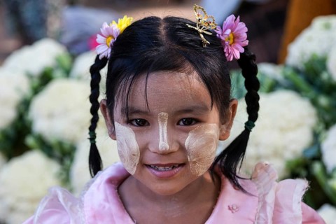 Local girl with braids and Thanka paste on her face