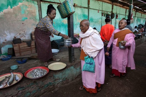 Buddhist monks collecting money