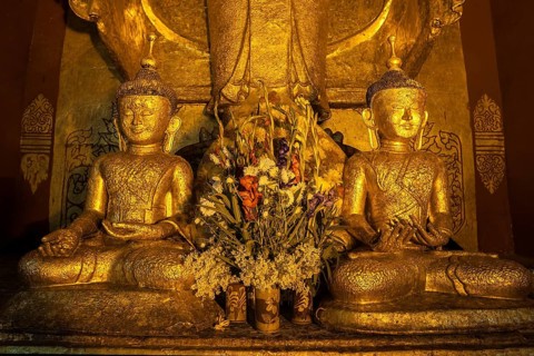 Two seated gilded Buddha statues