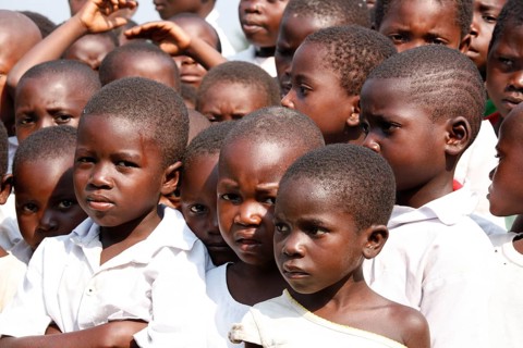 Group of students in schoolyard during morning assembly