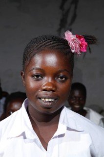 Schoolgirl in uniform with hair decoration