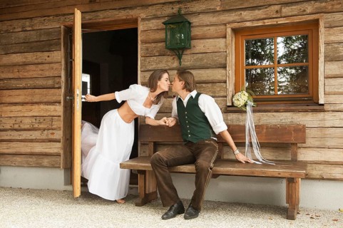 Wedding couple in front of an alpine mountain hut