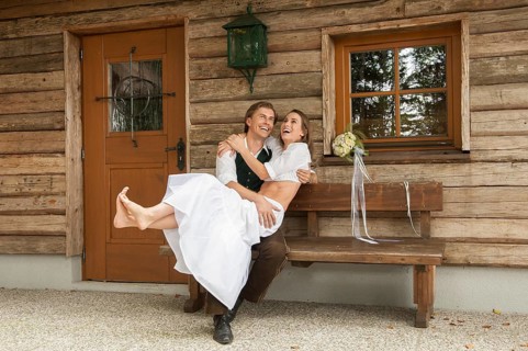 Wedding couple in front of an alpine mountain hut