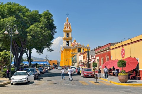 Road at Zocalo with the church of San Pedro Apostolo