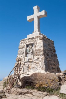 Stone cross and pilgrim sticks