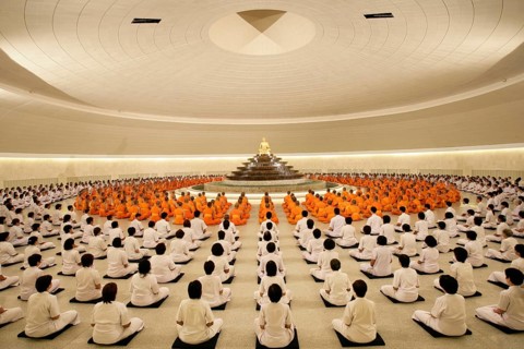 Monks meditating in the Phramonkolthepmuni meditation hall