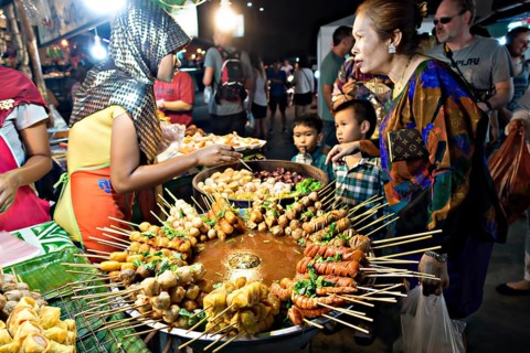 Stall with a large pot with skewers