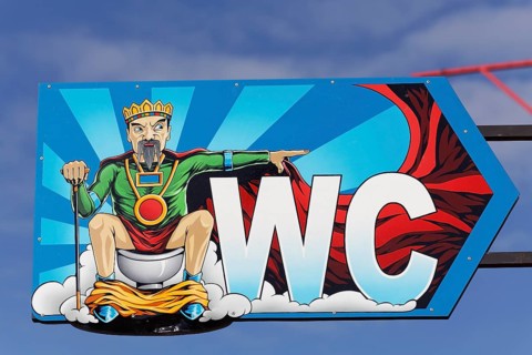 Toilet sign with Calafati figure