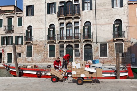 Boat with packages on a channel