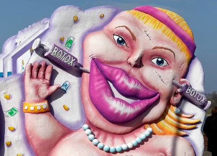 Woman with botox syringes in her face