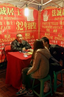 Chinese soothsayers in a lit tent