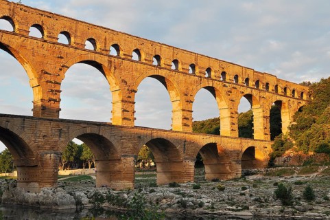 Roman aqueduct Pont du Gard over the Gardon in the evening