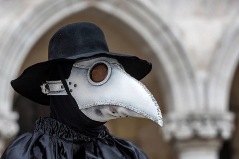 A man dressed in plague doctor costume